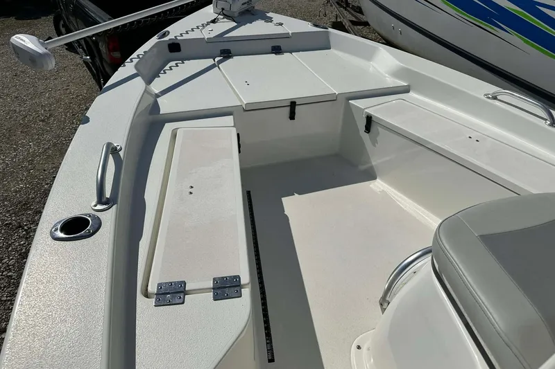 Slide: The Image of 2022 BayRider Kencraft 219 Bay boat interior with seating and storage compartments. - 44