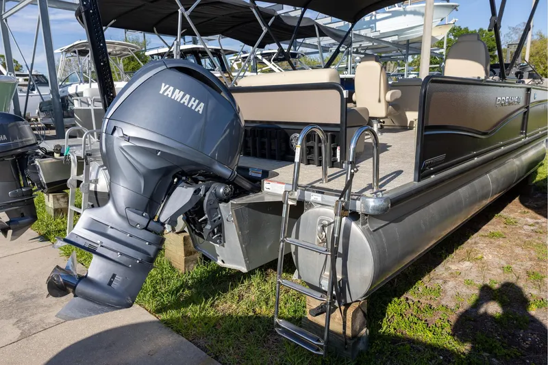 Slide: The Image of 2024 Premier 230 Sunsation RE pontoon boat with powerful 150 HP outboard motor. - 3