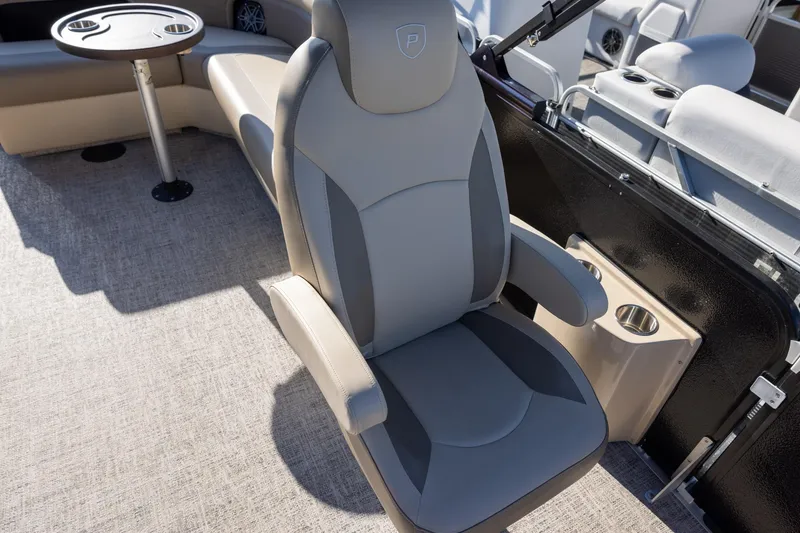 Slide: The Image of 2024 Premier 230 Sunsation RE boat interior with plush seating and speaker system. - 9