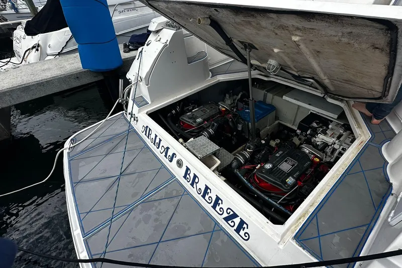 Slide: The Image of Open engine compartment of a 2008 Regal 38 Express boat at a dock. - 12