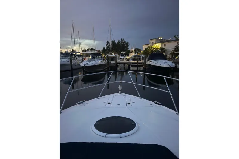 Slide: The Image of 2008 Regal 38 Express yacht docked at marina during twilight. - 15
