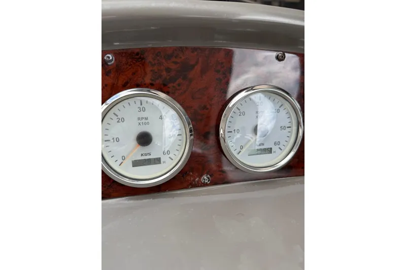 Slide: The Image of Dashboard gauges of a 2008 Regal 38 Express boat, showing RPM readings. - 18