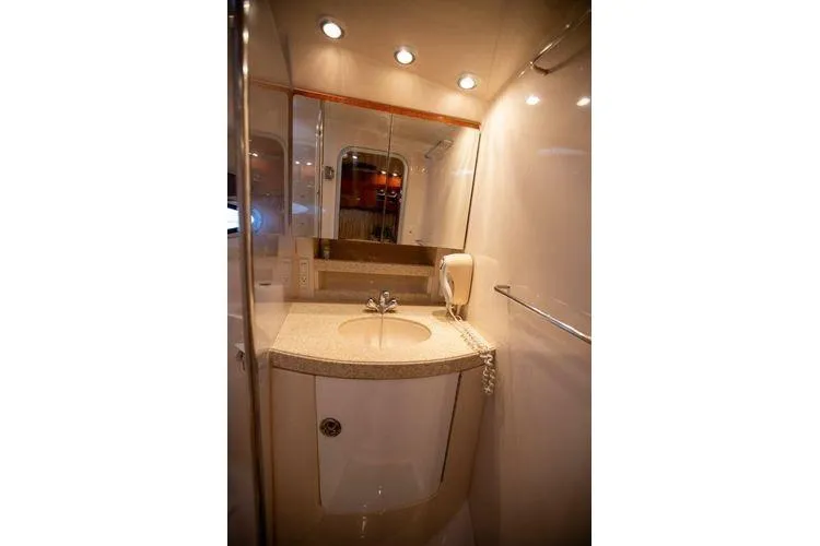 Slide: The Image of Luxurious bathroom in 2008 Regal 38 Express yacht with modern fixtures and lighting. - 19