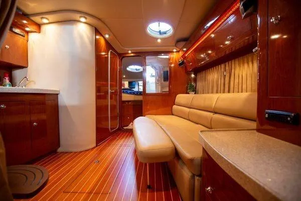 Slide: The Image of Luxurious interior of a 2008 Regal 38 Express yacht with elegant wood finishes. - 25