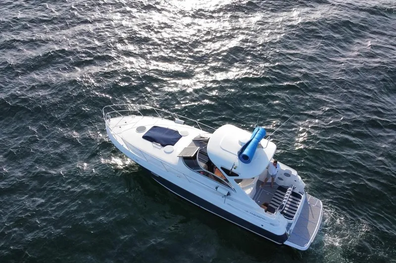 Slide: The Image of Aerial view of 2008 Regal 38 Express yacht cruising on open water. - 4