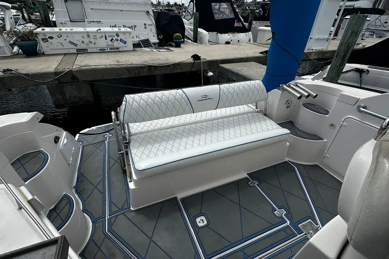 Slide: The Image of 2008 Regal 38 Express boat interior with cushioned seating and stylish flooring. - 9