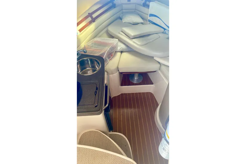 Slide: The Image of 2007 Grady-White Marlin 300 cabin interior with seating and kitchenette. - 3