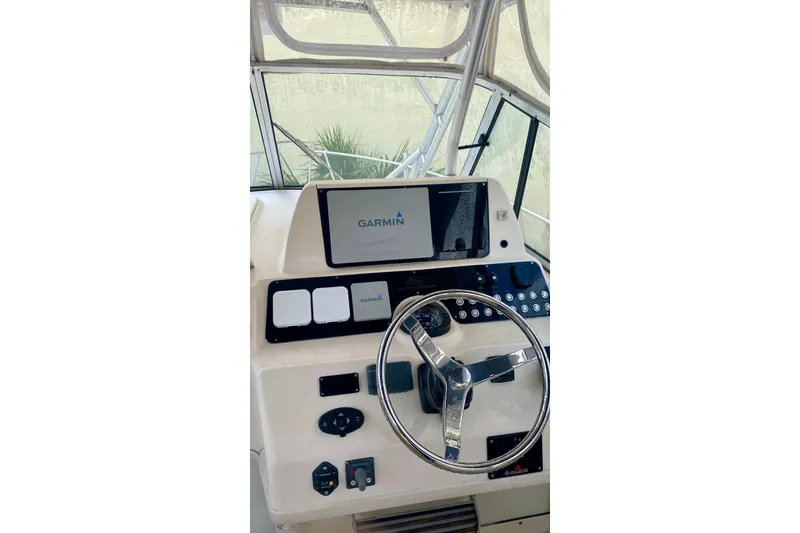 Slide: The Image of Helm of 2007 Grady-White Marlin 300 with Garmin navigation system. - 9