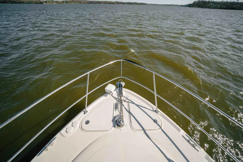 Slide: The Image of Luxurious bathroom in 2003 Sea Ray 420 Sundancer yacht, featuring modern amenities and elegant design. - 15