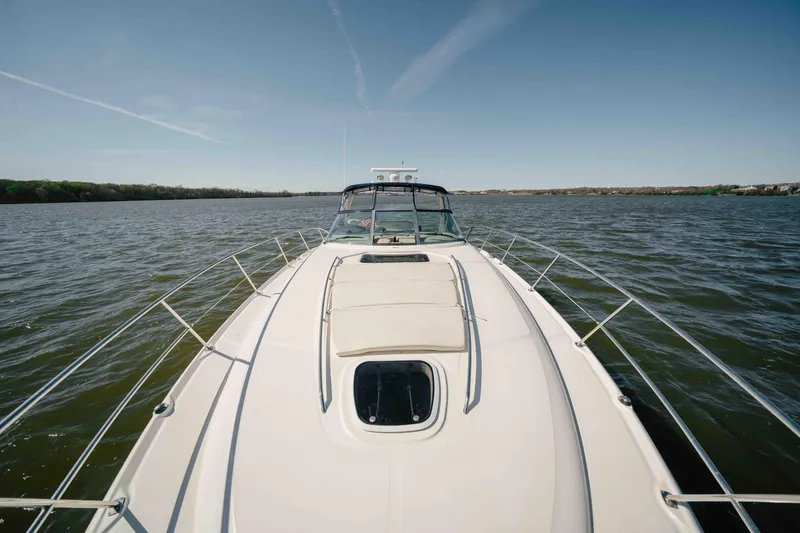 Slide: The Image of Luxurious interior of 2003 Sea Ray 420 Sundancer yacht with elegant wood cabinetry and modern amenities. - 16