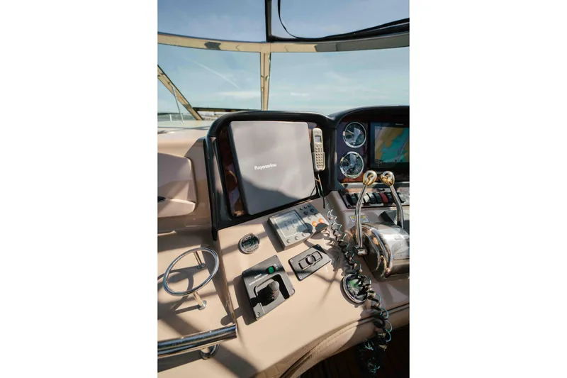 Slide: The Image of Bow view of 2003 Sea Ray 420 Sundancer cruising on a calm lake. - 21