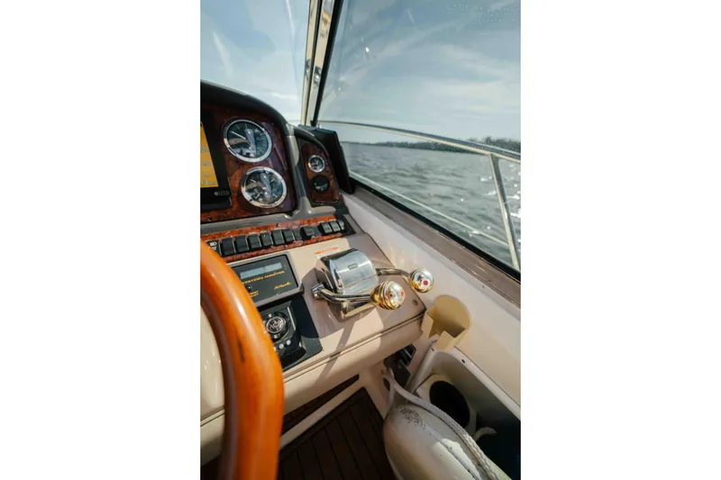 Slide: The Image of Bow view of 2003 Sea Ray 420 Sundancer cruising on open water. - 22