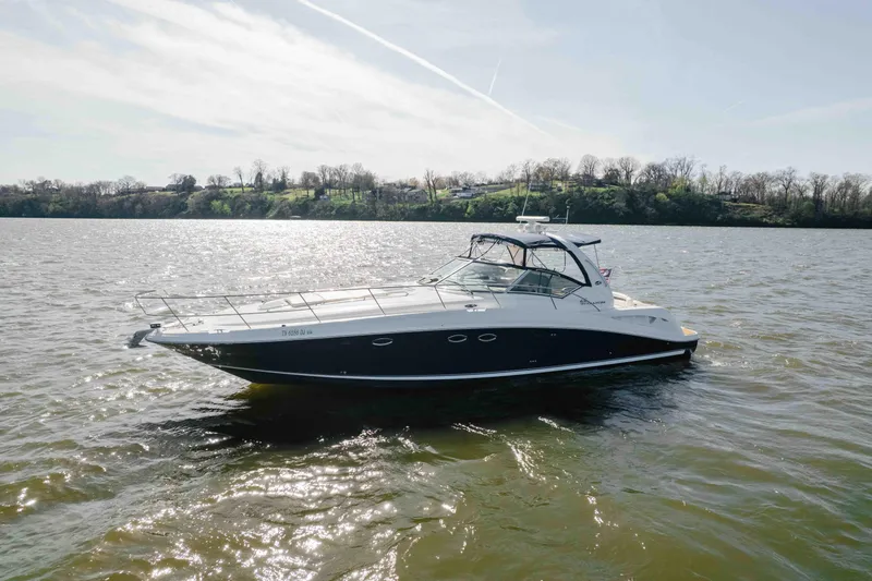 Slide: The Image of Cockpit of 2003 Sea Ray 420 Sundancer with navigation equipment and controls. - 28
