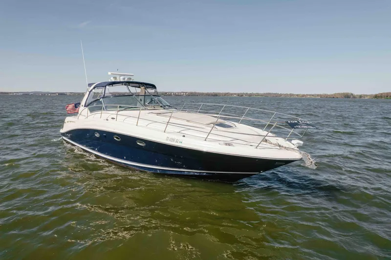 Slide: The Image of Dashboard of 2003 Sea Ray 420 Sundancer with navigation display and gauges. - 30