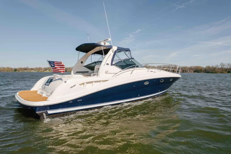Slide: The Image of 2003 Sea Ray 420 Sundancer boat with American flag, named "Bombero" from Nashville, TN. - 32