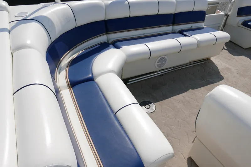 Slide: The Image of 2005 Bentley Pontoons 200 CRUISE interior with white and blue cushioned seating. - 10
