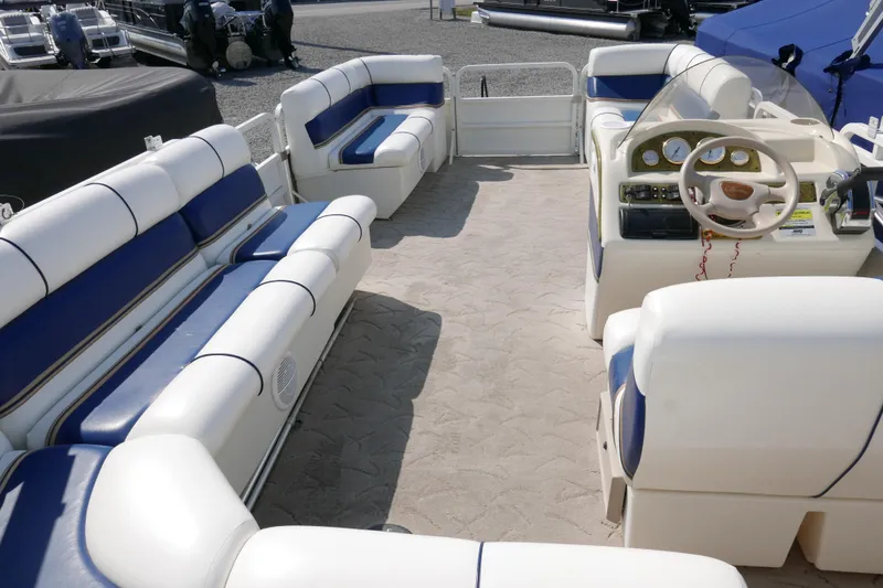 Slide: The Image of 2005 Bentley Pontoons 200 CRUISE interior with plush seating and steering console. - 11