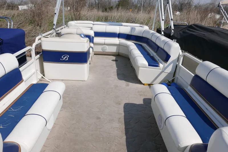 Slide: The Image of 2005 Bentley Pontoons 200 CRUISE interior with blue and white seating, outdoor setting. - 3