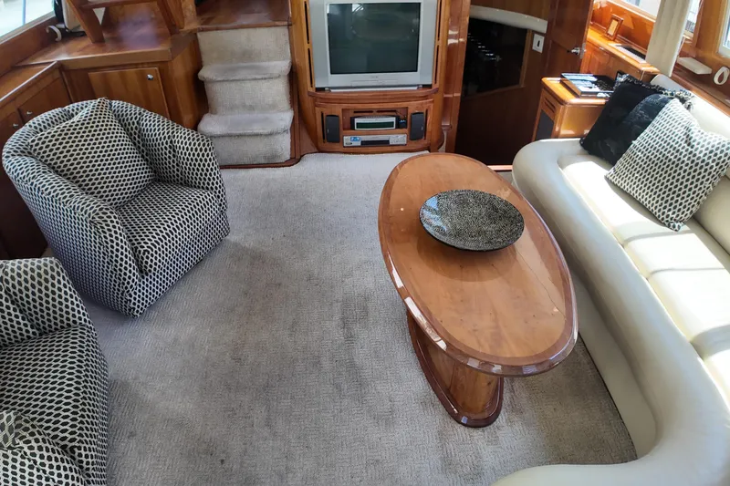 Slide: The Image of Luxurious 2003 Navigator Rival yacht interior with elegant seating and entertainment area. - 17