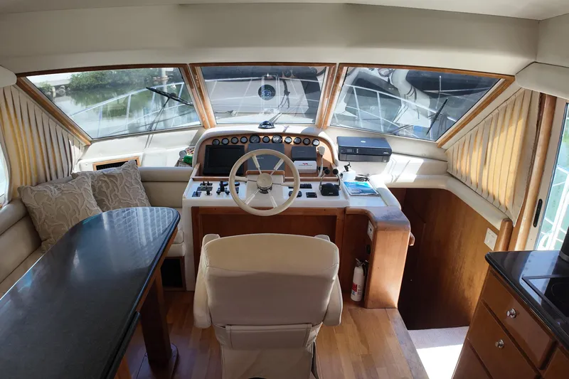 Slide: The Image of Interior view of 2003 Navigator Rival yacht cockpit with steering wheel and control panel. - 21