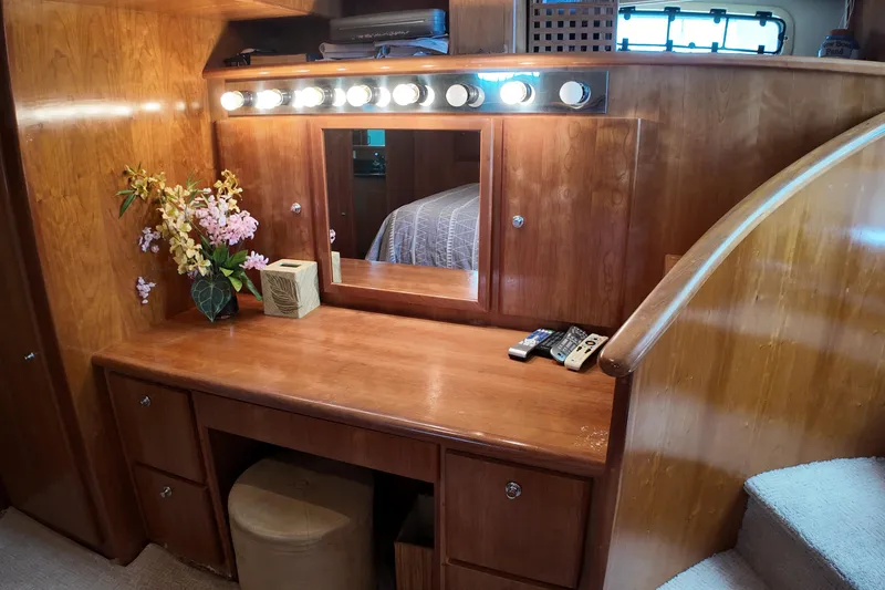 Slide: The Image of Wooden vanity with mirror and lights in 2003 Navigator Rival yacht interior. - 32