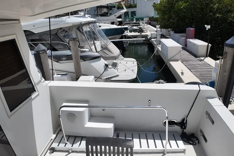 Slide: The Image of Docked 2003 Navigator Rival yacht with adjacent boats in marina setting. - 43