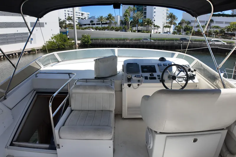 Slide: The Image of Cockpit of a 2003 Navigator Rival yacht with steering wheel and control panel. - 7