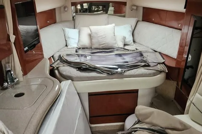 Slide: The Image of Interior cabin of 2002 Sea Ray Sundancer 320 with bed and seating area. - 14