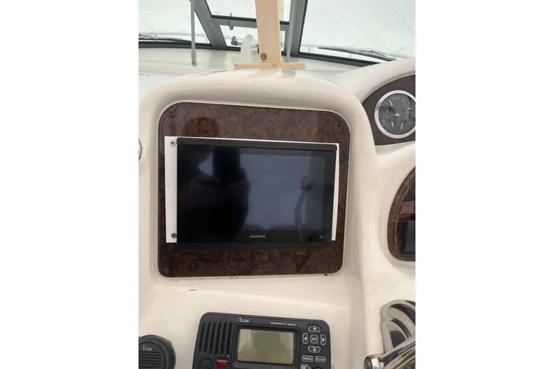 Slide: The Image of Dashboard of a 2002 Sea Ray Sundancer 320 with Garmin navigation system. - 9