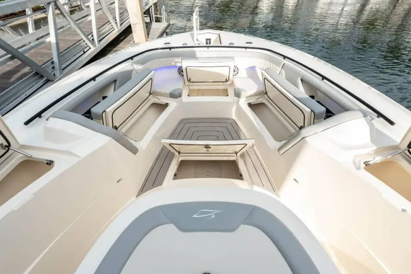 Slide: The Image of Manufacturer Provided Image: 2025 Scout 377 LXF boat interior with luxurious seating and storage compartments. - 4