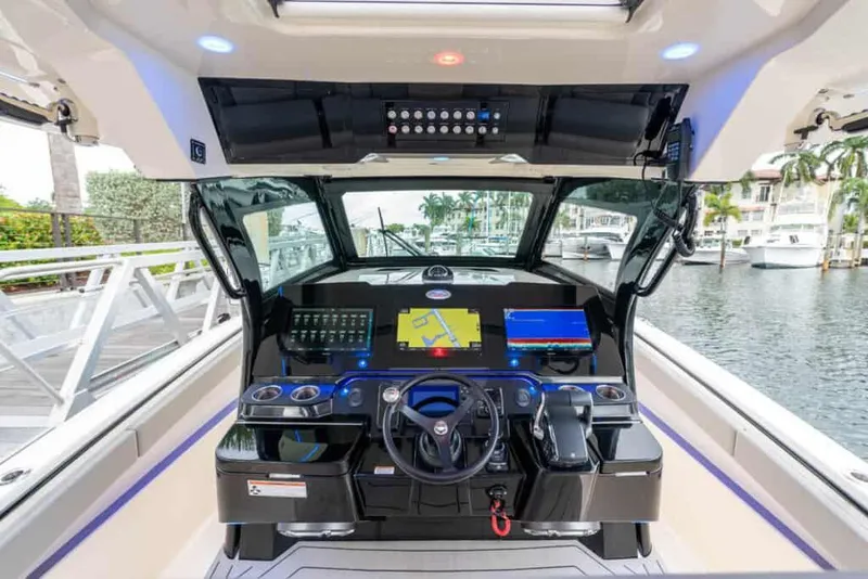 Slide: The Image of Manufacturer Provided Image: 2025 Scout 377 LXF boat cockpit with advanced navigation system and luxurious design. - 7
