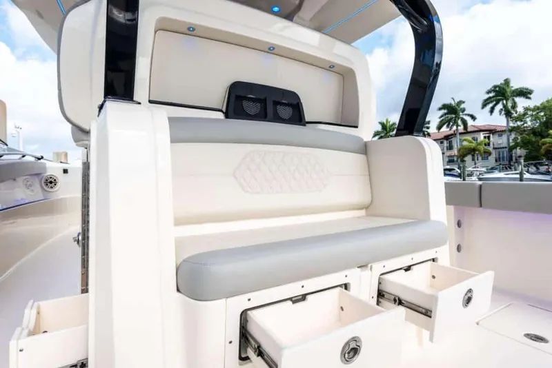 Slide: The Image of Manufacturer Provided Image: 2025 Scout 377 LXF boat interior with seating and storage drawers. - 8