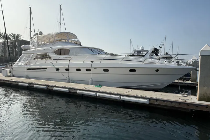 The Image of 1997 Viking Sport Cruisers 66 Motor Yacht docked at marina, side view. - 1
