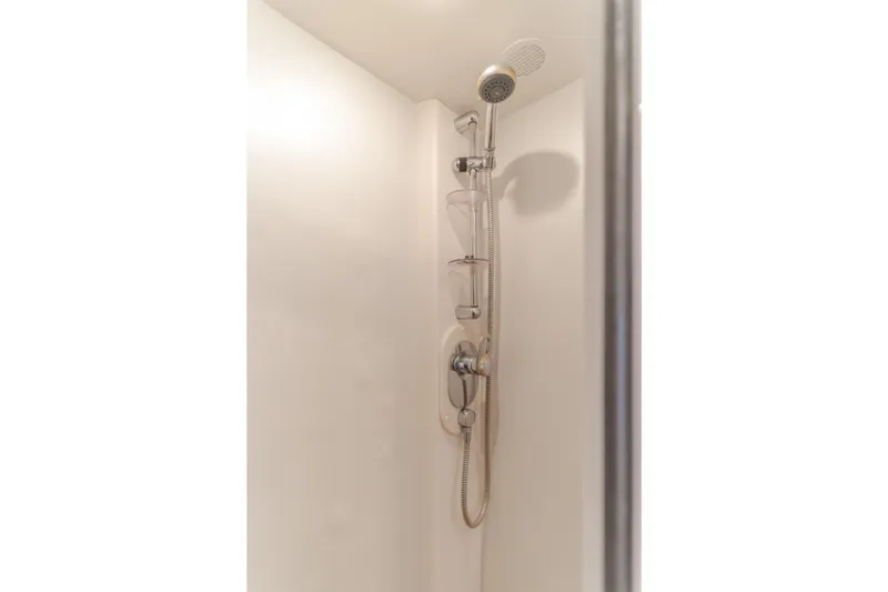 Slide: The Image of Shower area in 1997 Viking Sport Cruisers 66 Motor Yacht, featuring modern fixtures. - 15