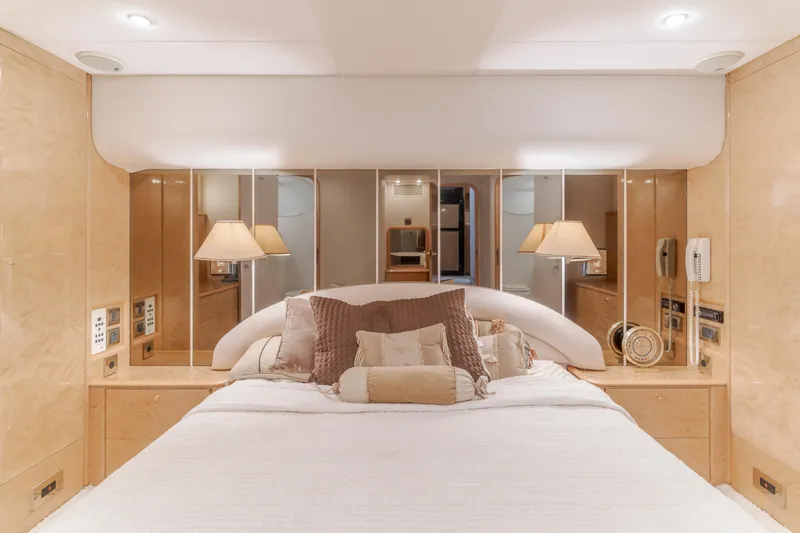 Slide: The Image of Luxurious bedroom interior of 1997 Viking Sport Cruisers 66 Motor Yacht with elegant decor. - 22