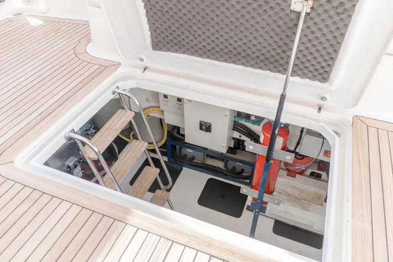 Slide: The Image of Engine room access on 1997 Viking Sport Cruisers 66 Motor Yacht with ladder and equipment. - 23