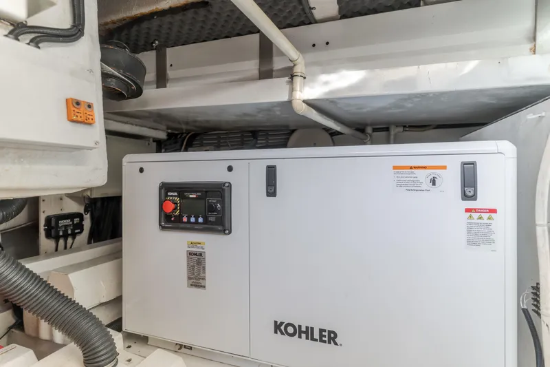 Slide: The Image of Engine room of 1997 Viking Sport Cruisers 66 Motor Yacht with Kohler generator. - 25