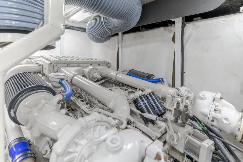 Slide: The Image of Engine room of 1997 Viking Sport Cruisers 66 Motor Yacht, showcasing mechanical components. - 27