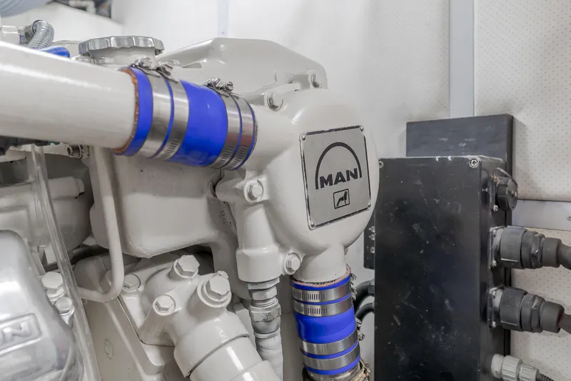 Slide: The Image of Engine room of 1997 Viking Sport Cruisers 66 Motor Yacht featuring MAN engine components. - 28