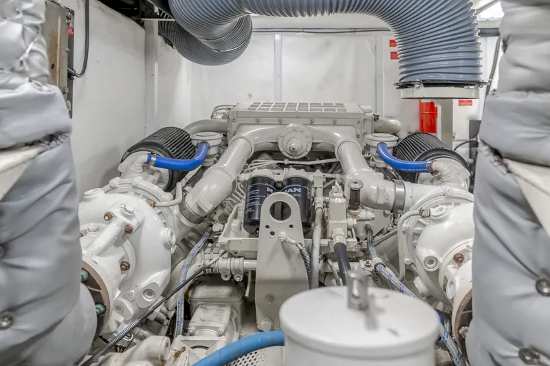 Slide: The Image of Engine room of a 1997 Viking Sport Cruisers 66 Motor Yacht, showcasing mechanical components. - 29