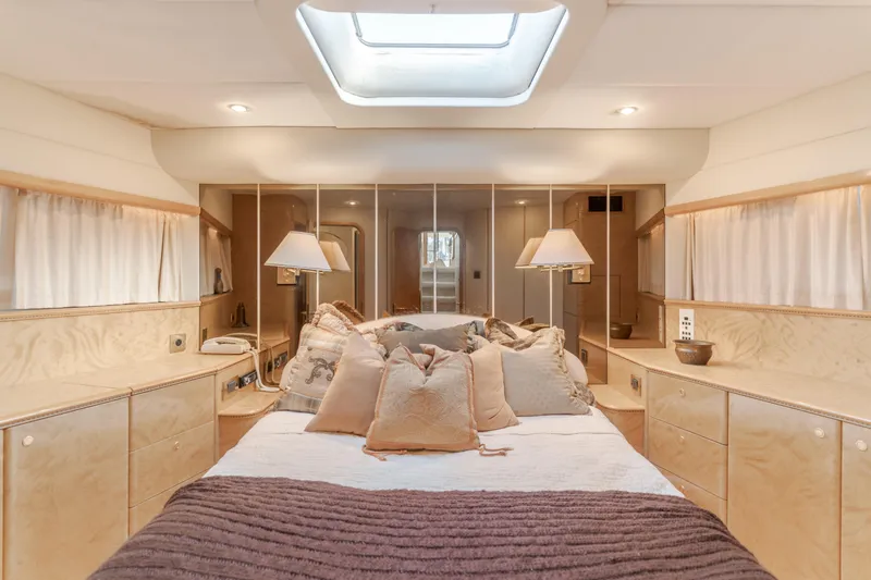 Slide: The Image of Luxurious bedroom interior of 1997 Viking Sport Cruisers 66 Motor Yacht with elegant decor. - 8
