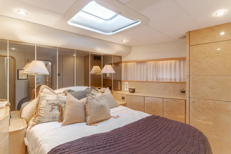 Slide: The Image of Luxurious bedroom interior of 1997 Viking Sport Cruisers 66 Motor Yacht with elegant decor. - 9