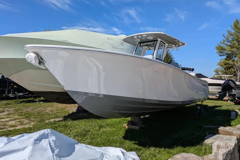 The Image of 2026 Sportsman Heritage 261 Center Console boat on display outdoors. - 0