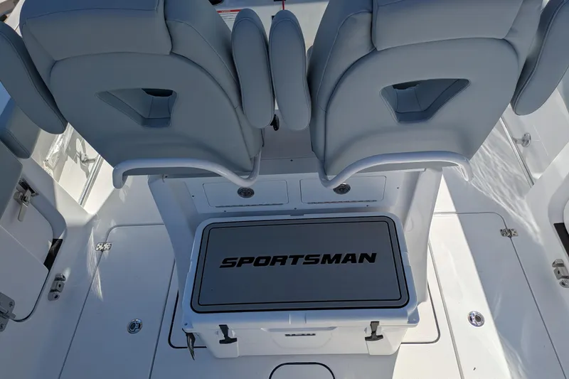 Slide: The Image of 2026 Sportsman Heritage 261 Center Console boat interior with cushioned seating and storage. - 12