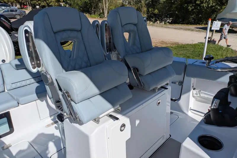 Slide: The Image of 2026 Sportsman Heritage 261 Center Console boat with luxurious seating and modern design. - 13