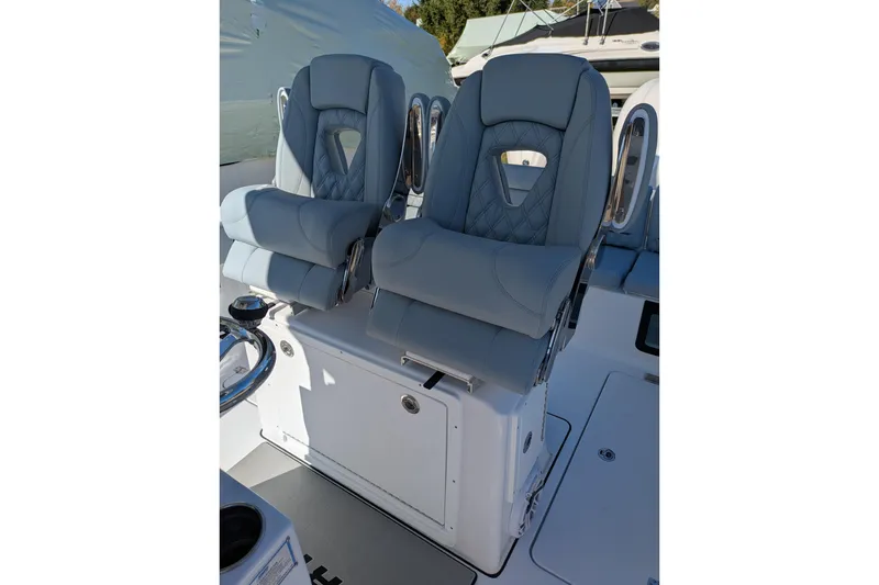 Slide: The Image of 2026 Sportsman Heritage 261 Center Console boat seats, featuring luxurious gray upholstery. - 14