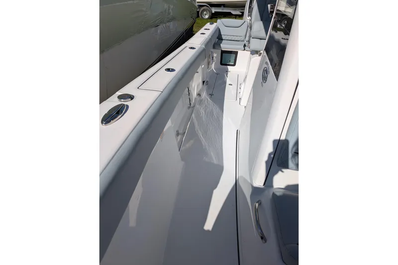 Slide: The Image of 2026 Sportsman Heritage 261 Center Console boat interior, showcasing sleek design and seating. - 18