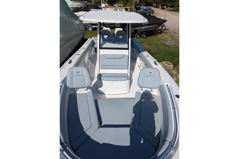 Slide: The Image of 2026 Sportsman Heritage 261 Center Console boat with sleek seating and modern design. - 19