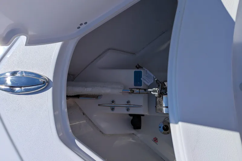 Slide: The Image of 2026 Sportsman Heritage 261 Center Console anchor locker with stainless steel hardware. - 20