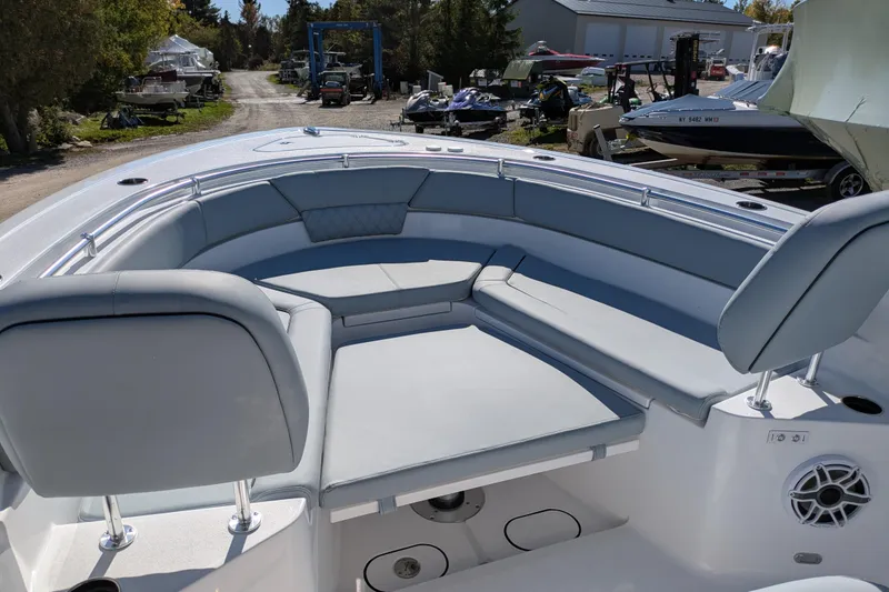 Slide: The Image of 2026 Sportsman Heritage 261 Center Console boat with spacious seating and modern design. - 21
